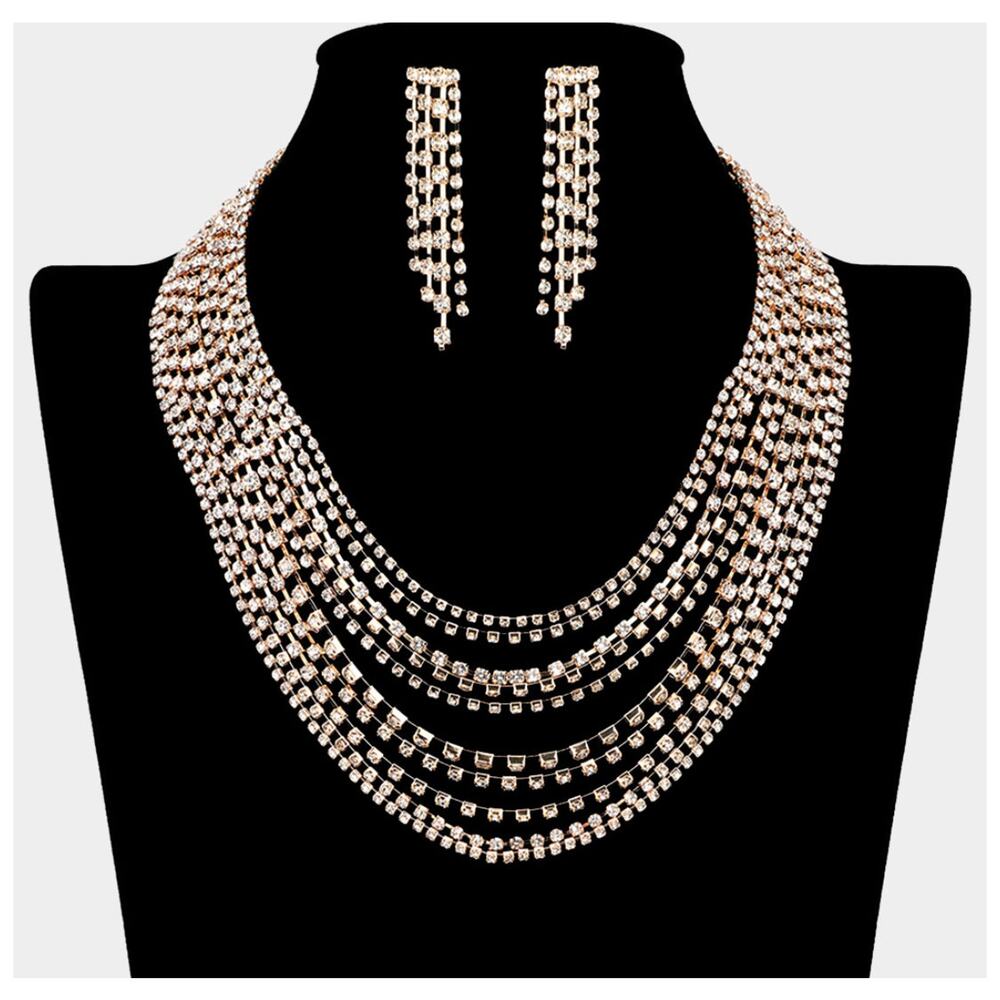 Pierced gold and clear stone multi layered necklace and earring set